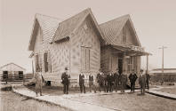 Henry Jacob Lutcher (1836-1912) (second from left) with group in front of the office building o…